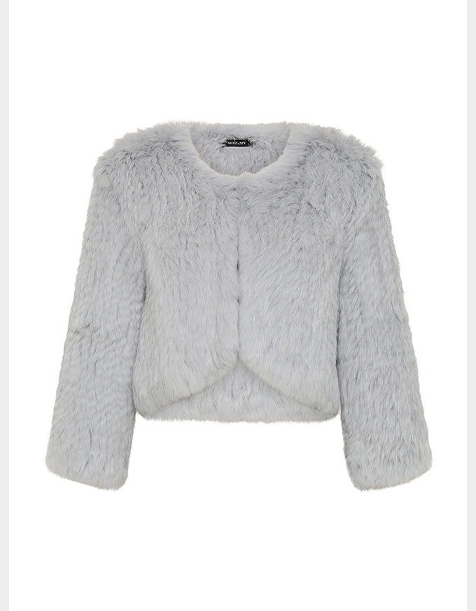 A light gray/ baby blue faux fur cropped jacket with long sleeves and a round neckline, shown against a plain white background.