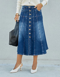 Person wearing a blue denim skirt with a button-down front, holding a black handbag against a light gray background.