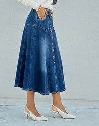 Person wearing a blue denim skirt with a plain background