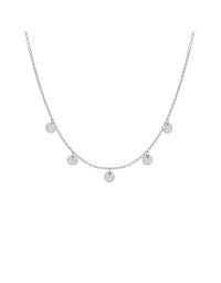 Silver necklace with small round pendants on a white background