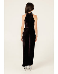 Black halter neck dress worn by a model on a white background