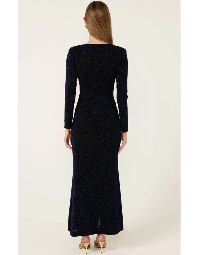 Woman wearing a long black dress on a white background