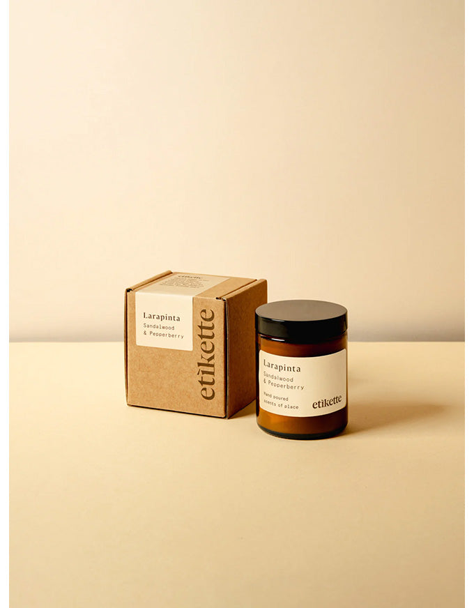 Jar and box of etikette Larapinta on a beige background