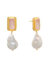Gold earrings with pink gemstones and pearl-like drops on a white background