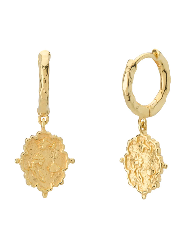 Gold hoop earrings with intricate designs on a white background