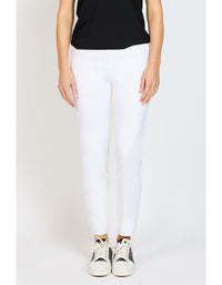 Person wearing white pants and black top on a light gray background