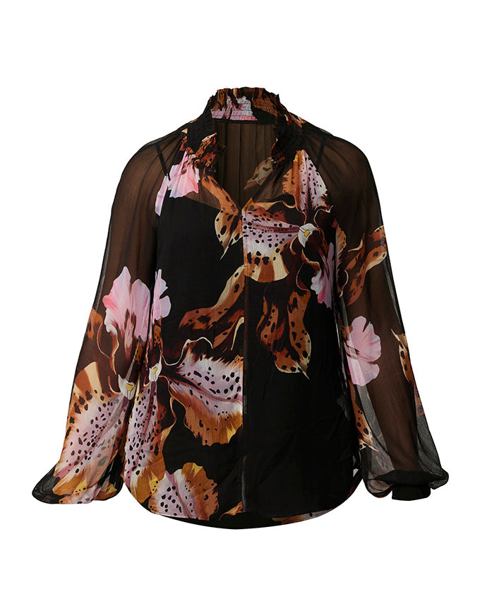A sheer black long-sleeve blouse with a vibrant floral and leopard print overlay in pink, orange, and brown, displayed on a clean white background.