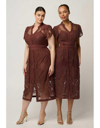 Two women modeling matching brown lace midi dresses with short sleeves, V-necklines, and self-tie waistbelts against a plain light gray studio background.