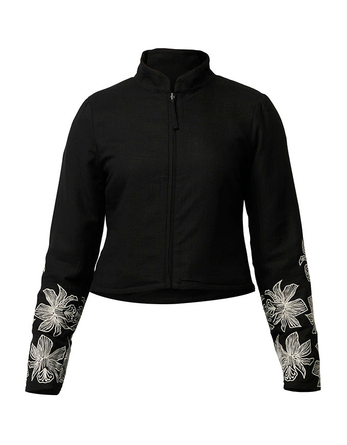 A black cropped zip-up jacket with a stand collar and white floral embroidery on the lower sleeves, shown against a plain white background.