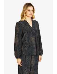 Woman wearing a black patterned outfit on a white background