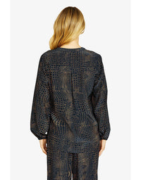 Person wearing a black patterned outfit on a white background