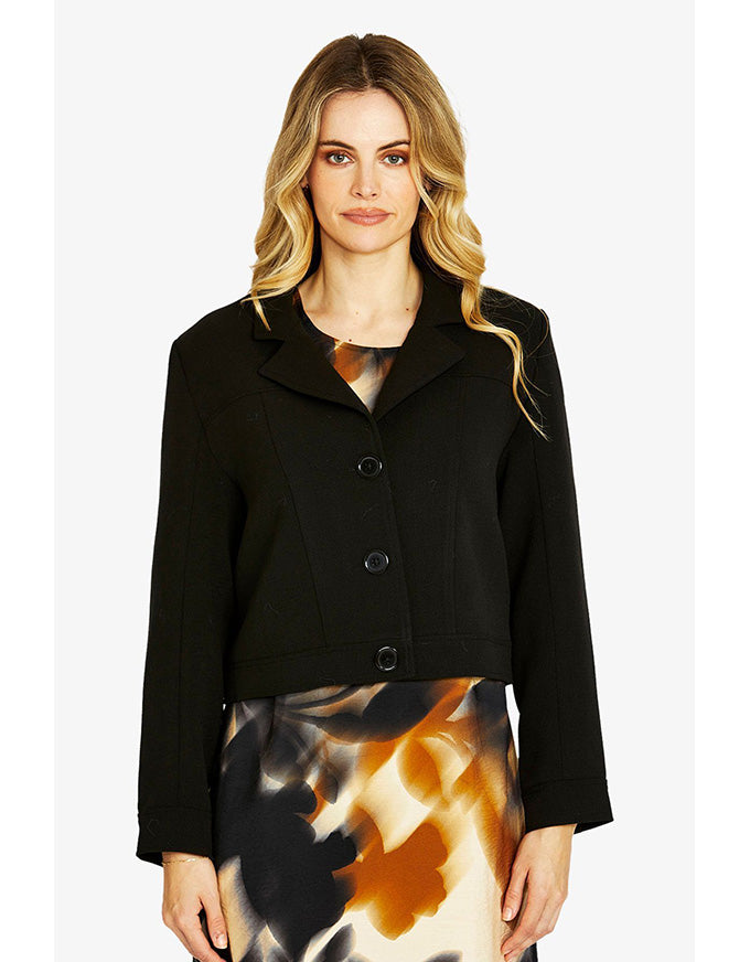 Woman wearing a black jacket on a white background