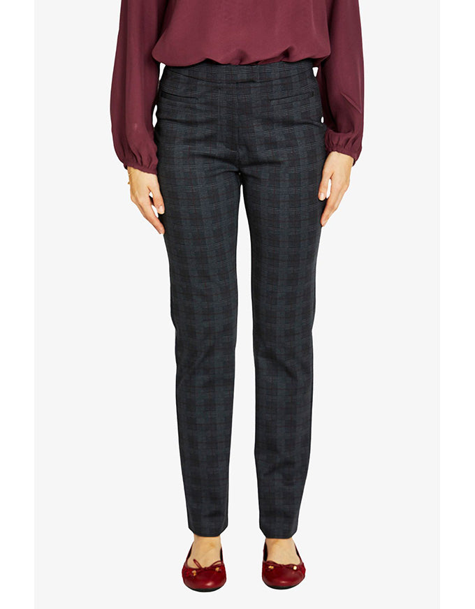 Person wearing dark gray checkered pants and a burgundy top on a white background