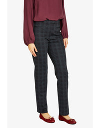 Person wearing dark plaid pants and a burgundy top on a white background