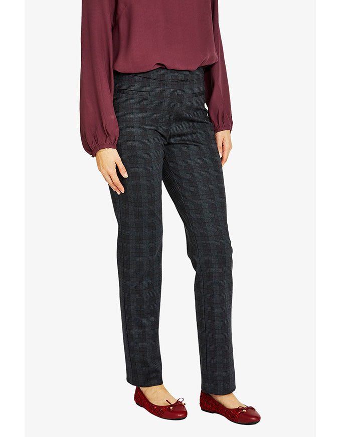 Person wearing dark plaid pants and a burgundy top on a white background