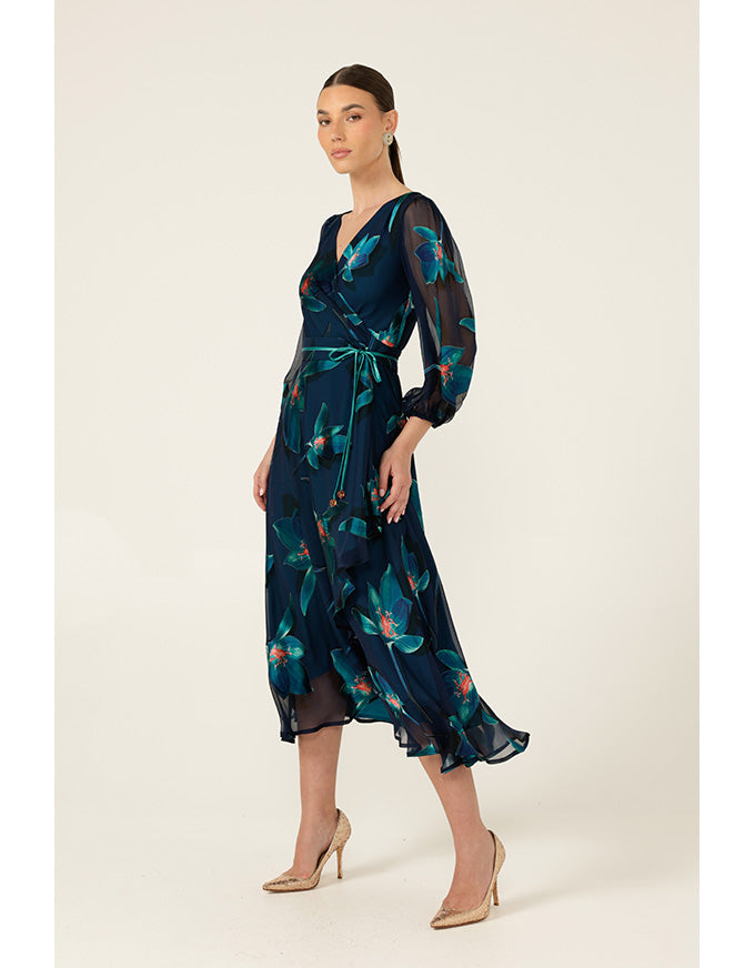 Woman wearing a dark blue floral dress on a beige background