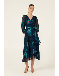 Woman wearing a dark blue floral dress on a white background