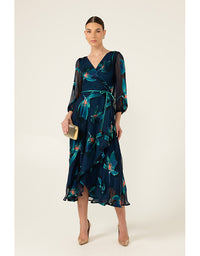 Woman wearing a dark blue floral dress on a beige background