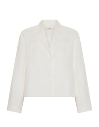 An off-white cropped blazer with notch lapels, flap chest pockets, and a single front button, shown on a plain white background.
