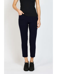 Person wearing black pants and black shoes on a white background