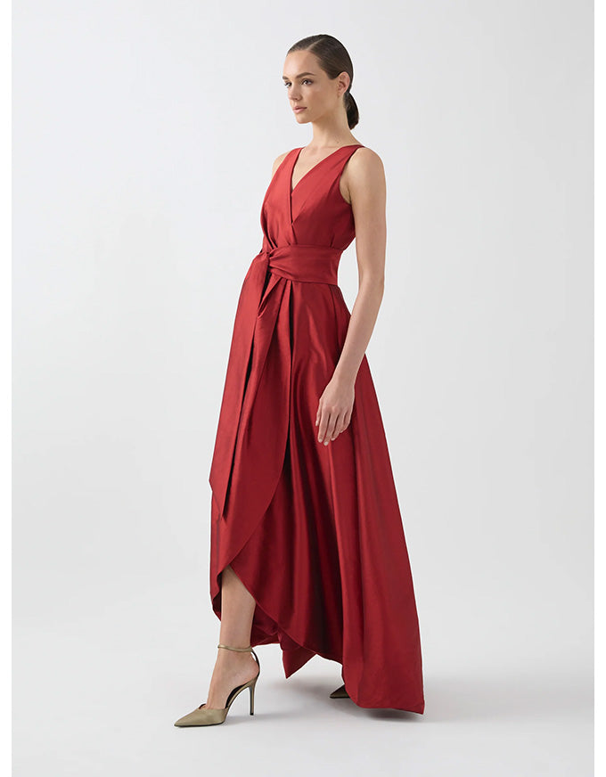 Woman wearing a red dress on a white background