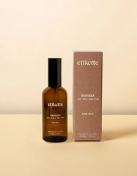 Brown bottle and box of etikette Barossa room mist on a beige background