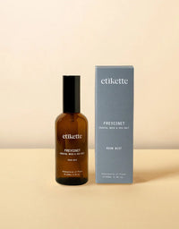 Brown bottle and blue box of etikette Freycinet room mist on a beige background