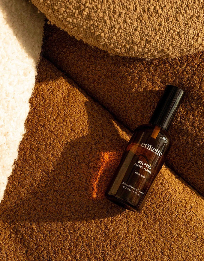 Elixit bottle on a textured brown surface
