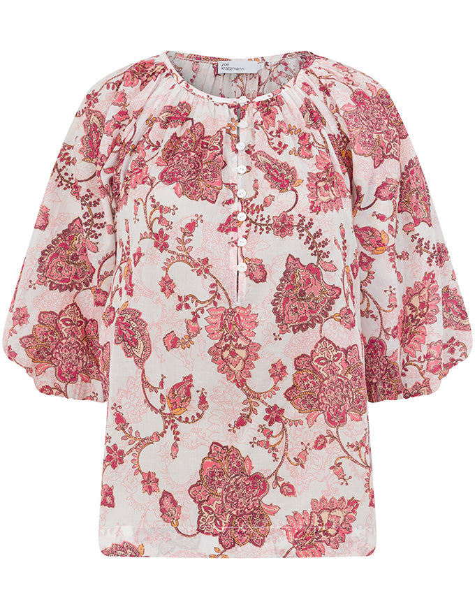 A women's short-sleeve blouse with a round neckline, gathered shoulders, and a pink and red floral paisley pattern on a light cream background. Vow Top Rose Paisley
