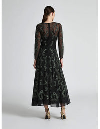 Woman wearing a black lace dress on a white background