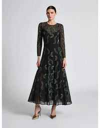 Woman wearing a black floral lace dress on a white background