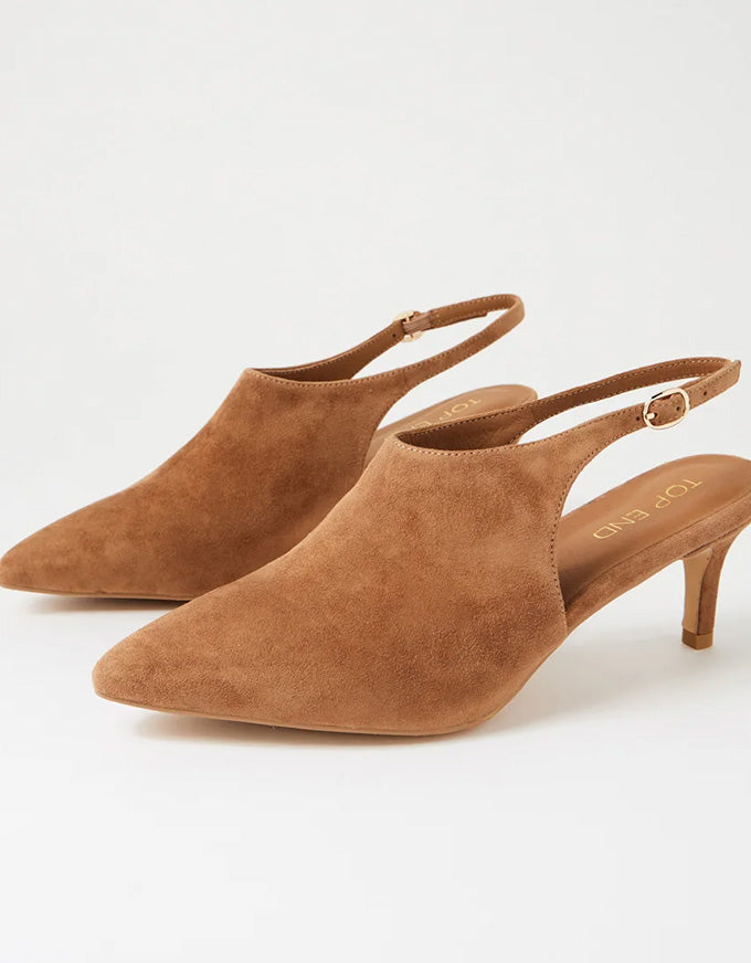 Pair of brown suede slingback heels on a white background