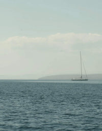 Sailboat on a calm sea with a clear sky