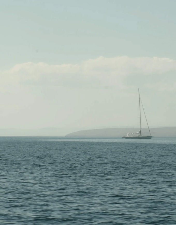 Sailboat on a calm sea with a clear sky