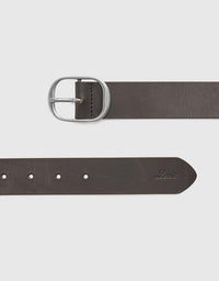 Brown leather belt with silver buckle on a light gray background