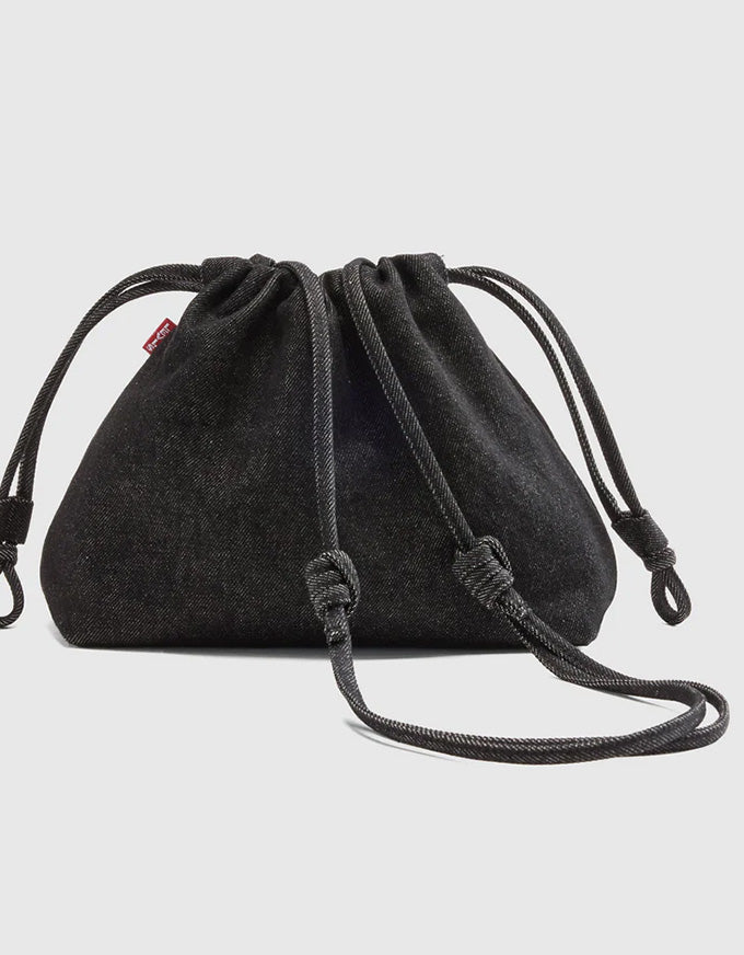 Black drawstring bag on a light gray background