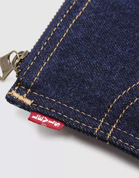 Close-up of a dark blue denim zippered pouch with gold-colored contrast stitching and a red Levi's brand tag.