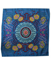 Colorful mandala design on a blue fabric background