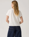Person wearing a white t-shirt and dark blue jeans on a plain background. Graphic Boxy TShirt Western Archival