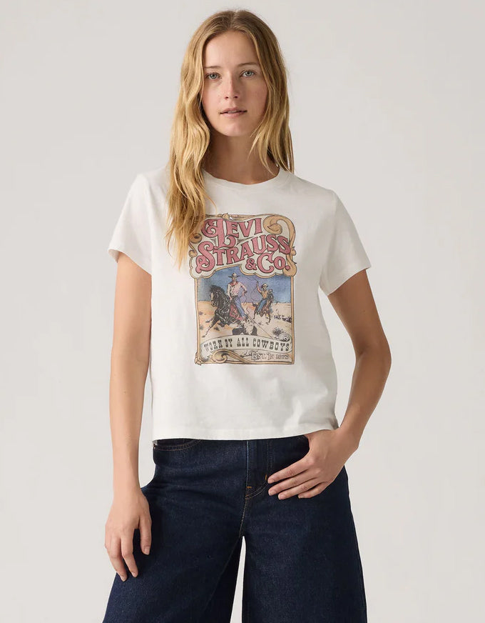 Woman wearing a white t-shirt with a graphic design on a plain background. Graphic Boxy TShirt Western Archival