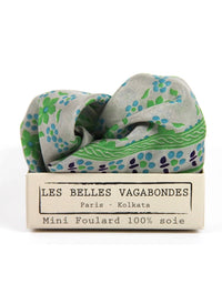 Mini foulard with floral pattern in a Les Belles Vagabondes packaging on a white background