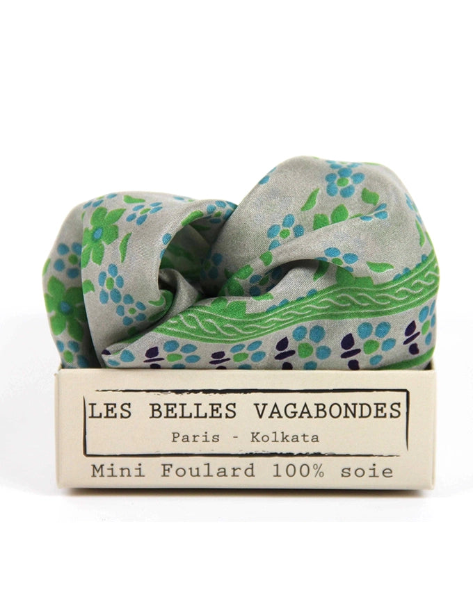 Mini foulard with floral pattern in a Les Belles Vagabondes packaging on a white background