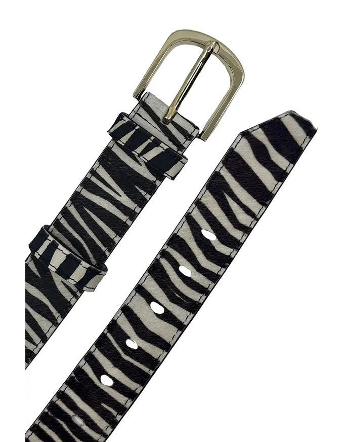 Zebra pattern belt with a silver buckle on a white background