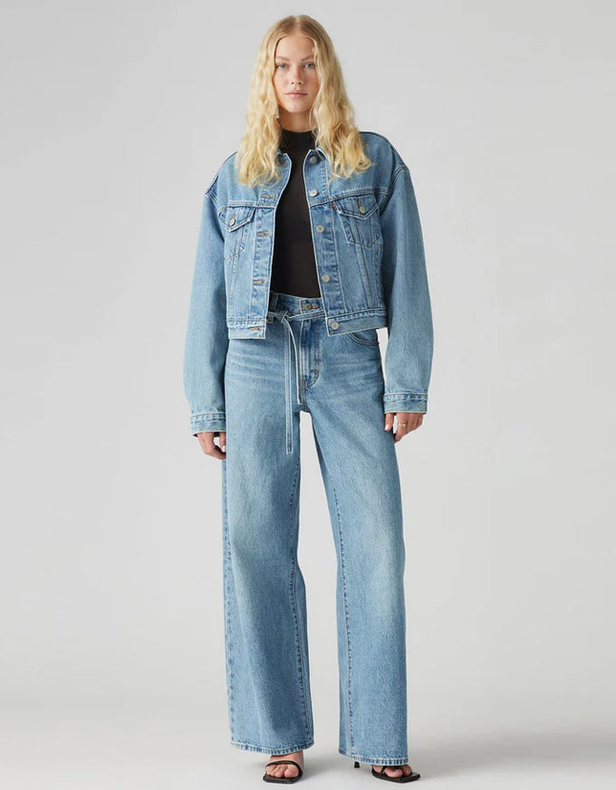 Person wearing a denim jacket and jeans on a plain background. XL Straight Jeans - Thanks Friend