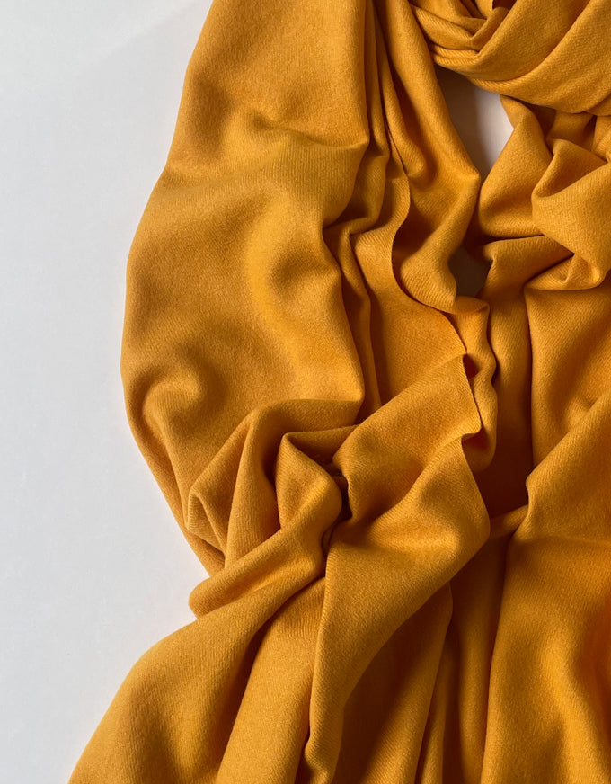 The Cashmere Scarf in Mustard.