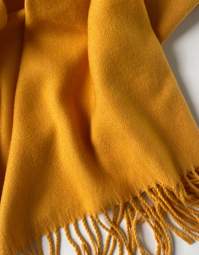 The Cashmere Scarf in Mustard.